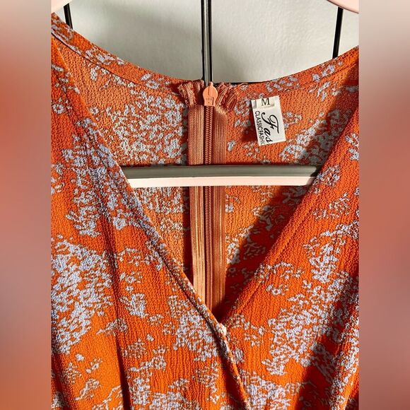 Unbranded women’s floral long sleeve rust colored romper NWOT - Picture 6 of 10